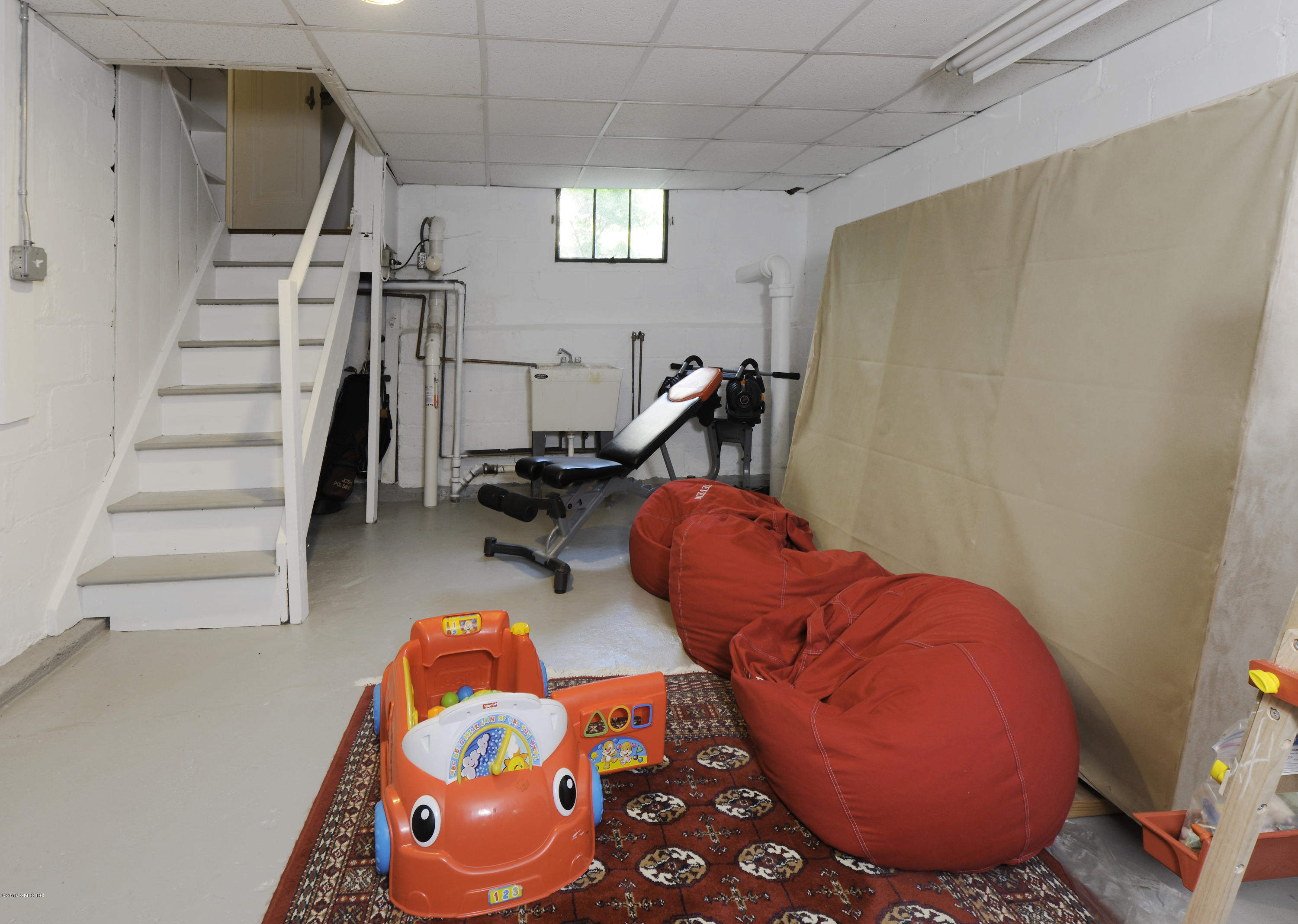 36 Valleywood Road Cos Cob, CT 06830 - Photo 32 of 45 a room with lots of gym equipment and wooden floor