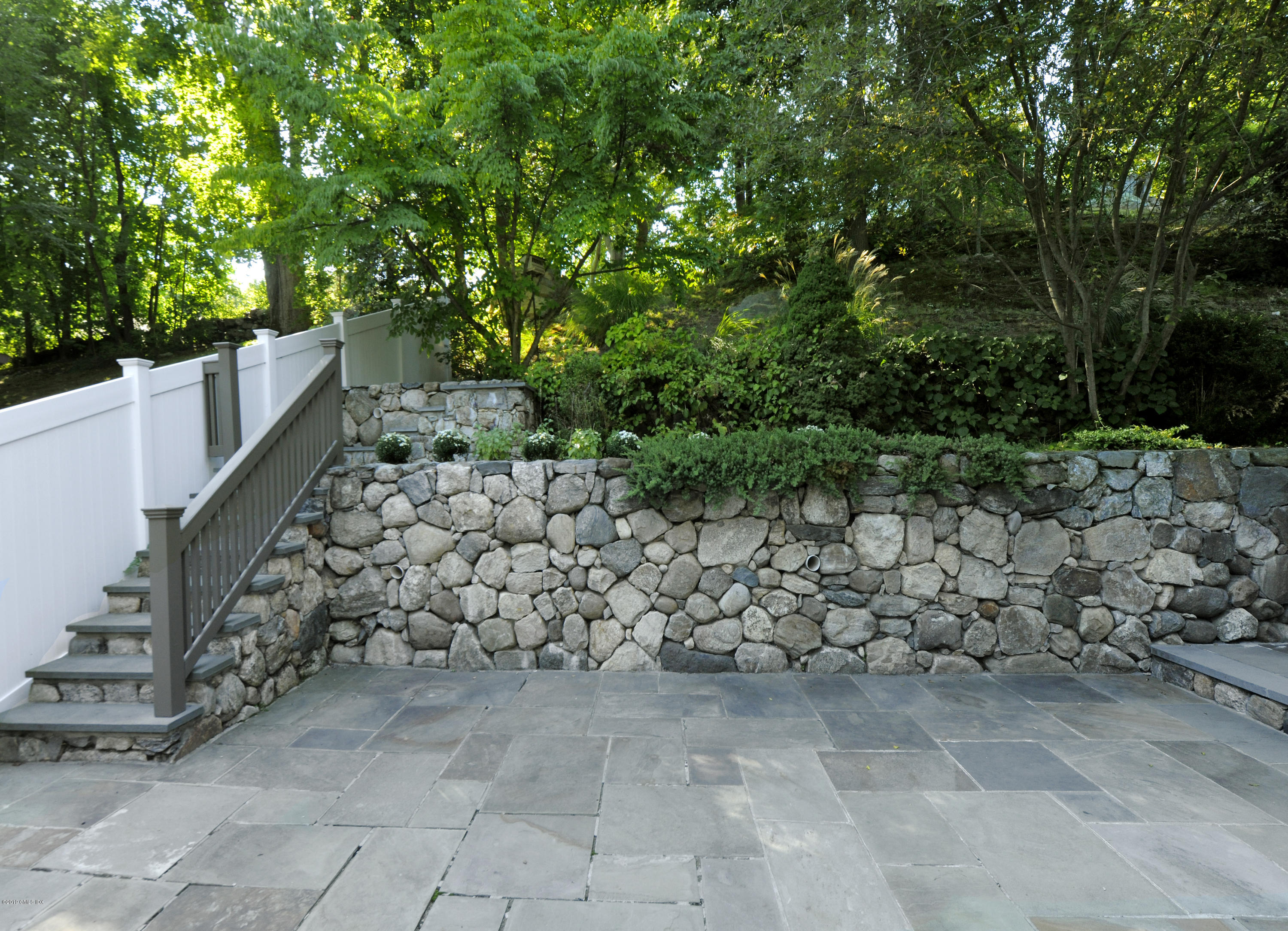 36 Valleywood Road Cos Cob, CT 06830 - Photo 35 of 45 a view of a yard with wooden fence