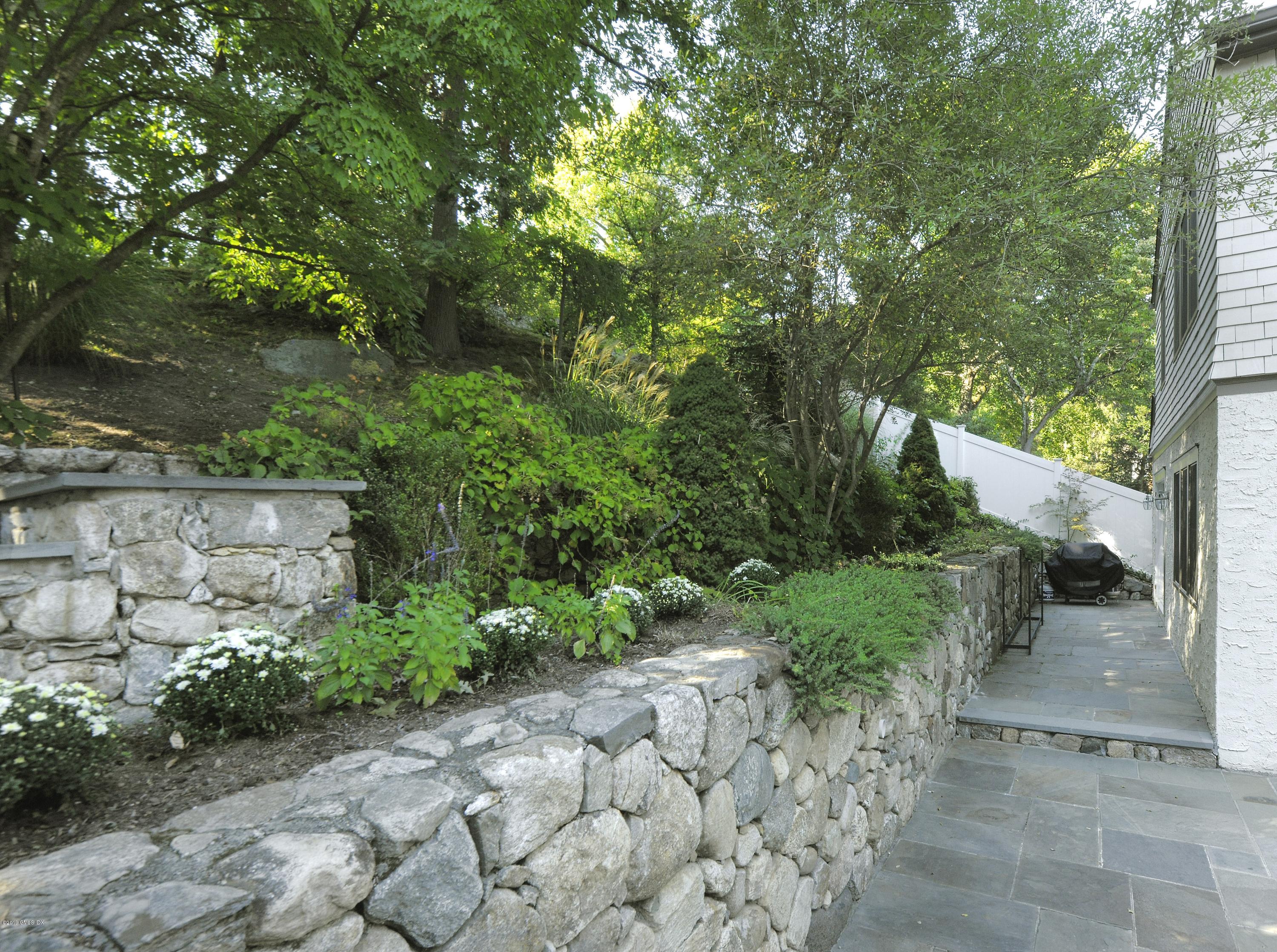 36 Valleywood Road Cos Cob, CT 06830 - Photo 36 of 45 a view of backyard with outdoor seating and green space
