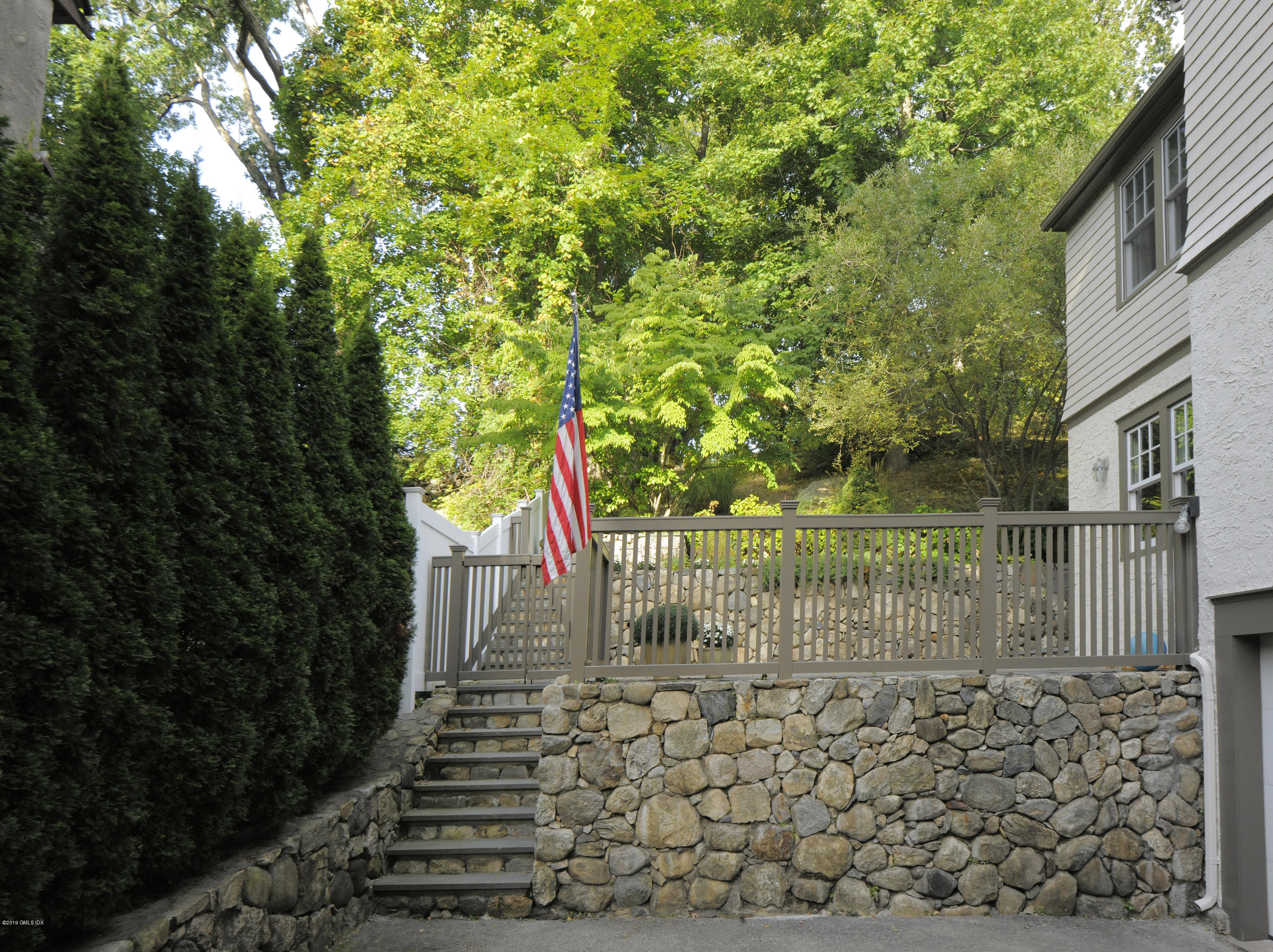 36 Valleywood Road Cos Cob, CT 06830 - Photo 38 of 45 a view of fountain with wooden fence