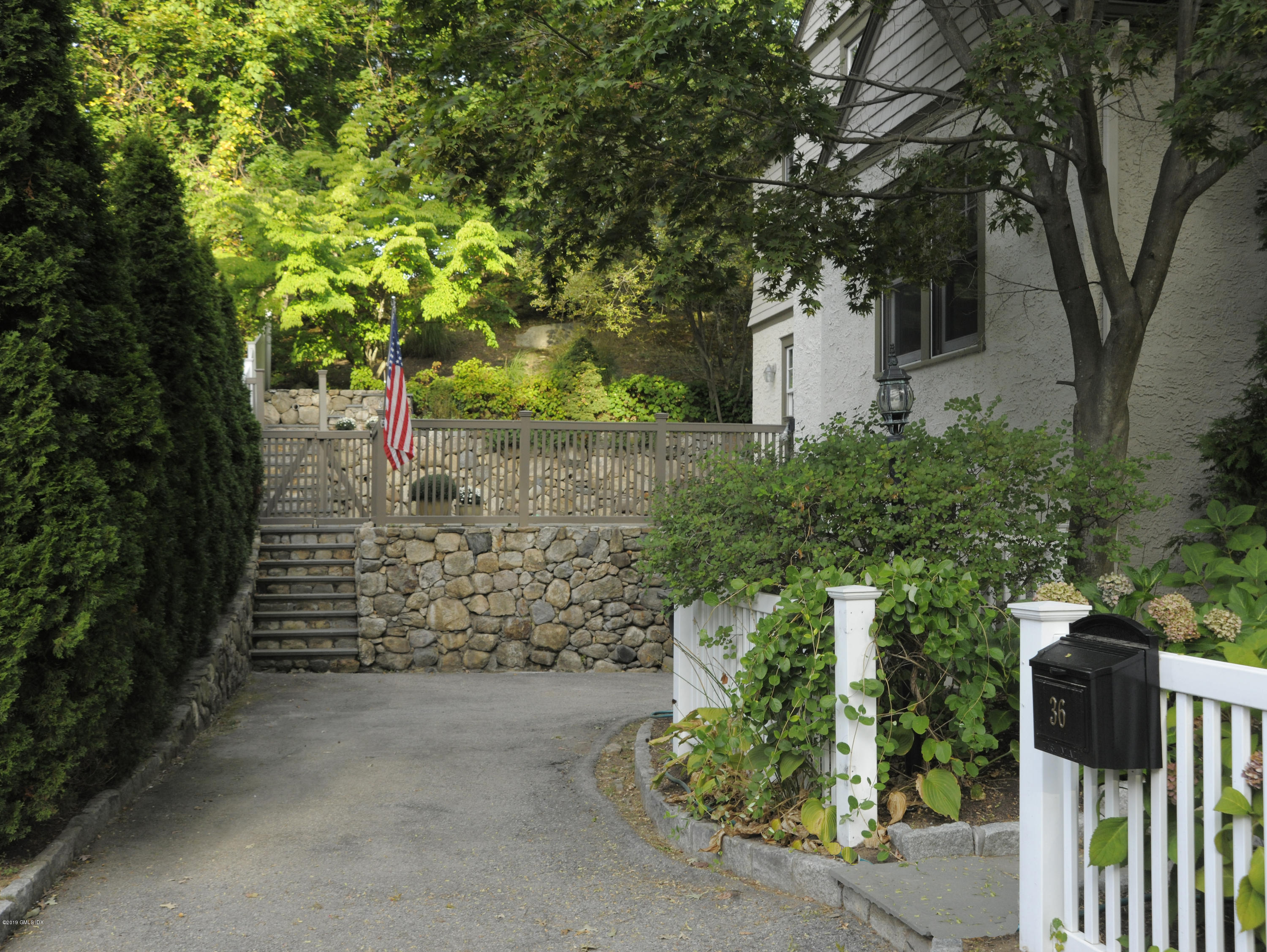 36 Valleywood Road Cos Cob, CT 06830 - Photo 39 of 45 a pathway of a house with a yard