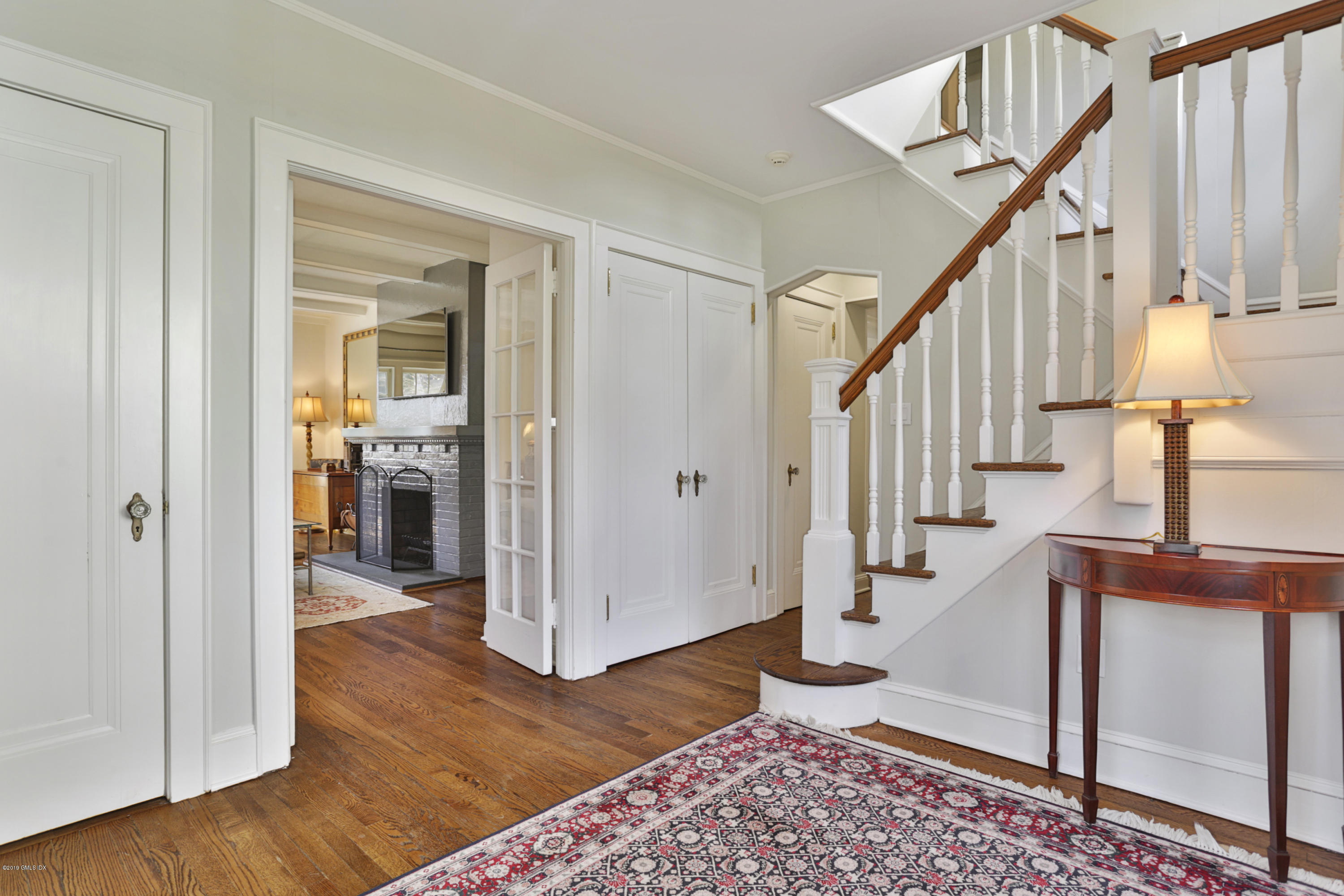 36 Valleywood Road Cos Cob, CT 06830 - Photo 4 of 45 a view of entryway with wooden floor and stairs