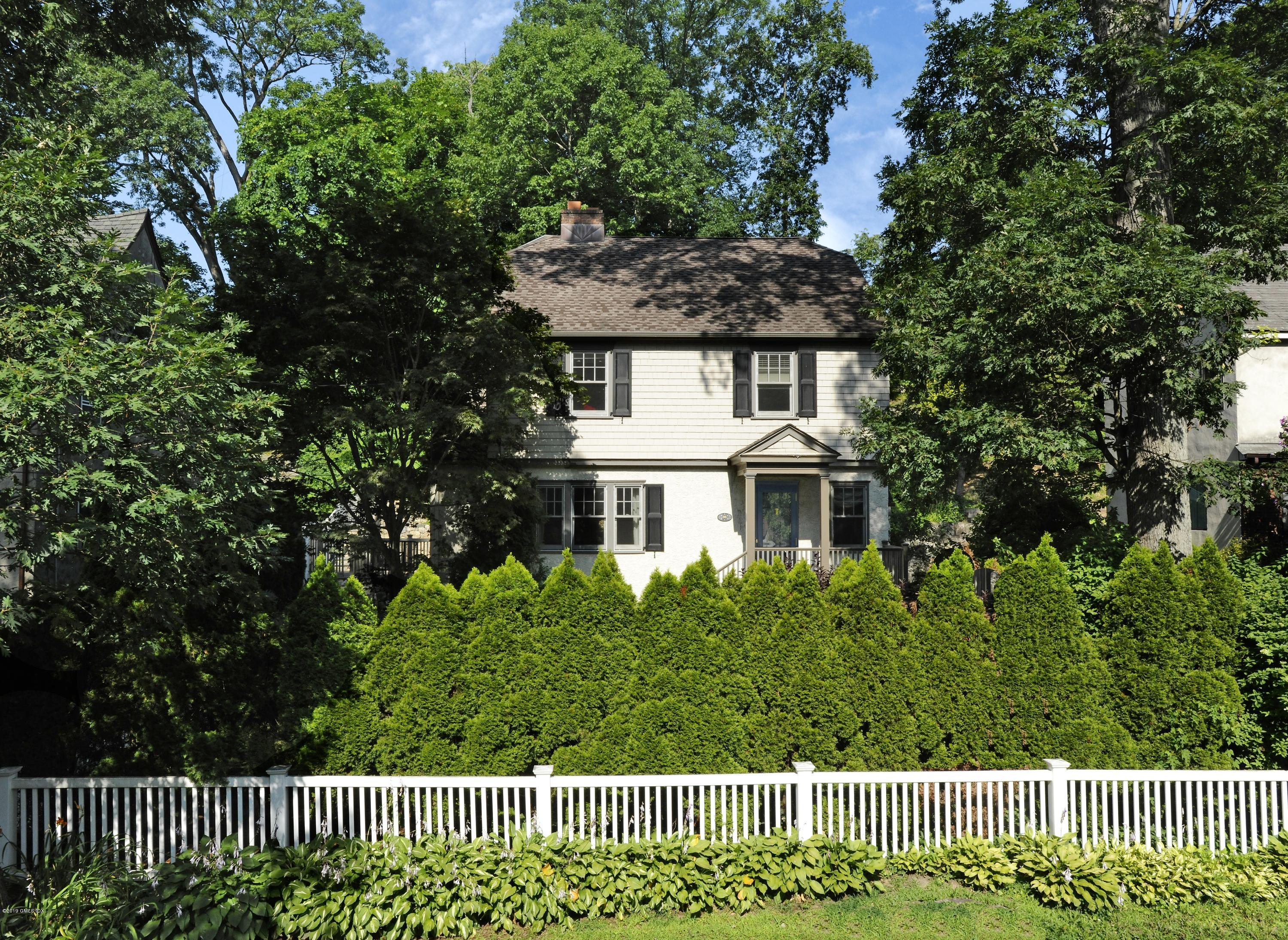36 Valleywood Road Cos Cob, CT 06830 - Photo 41 of 45 a front view of a house with a garden