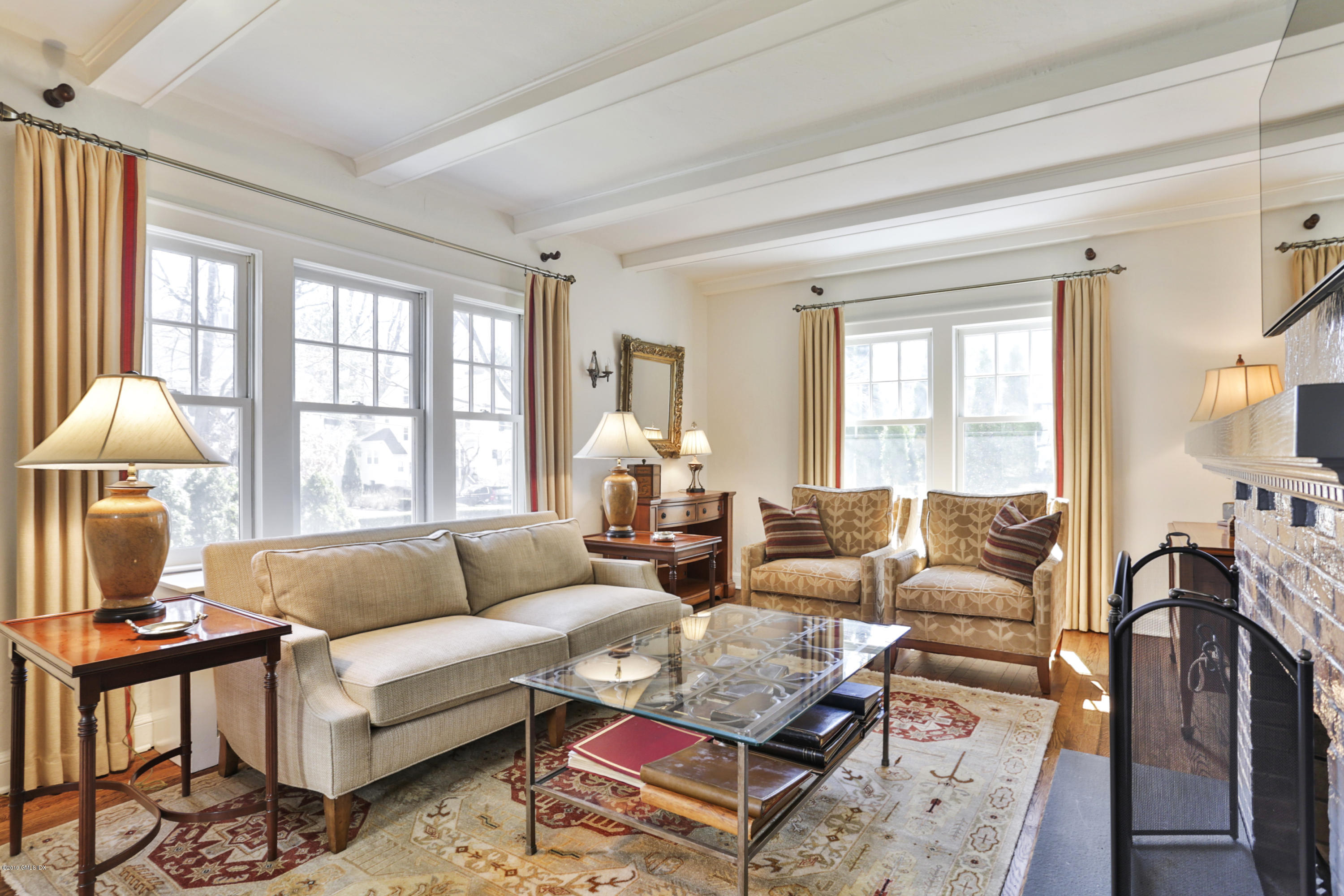 36 Valleywood Road Cos Cob, CT 06830 - Photo 5 of 45 a living room with furniture large window and a table