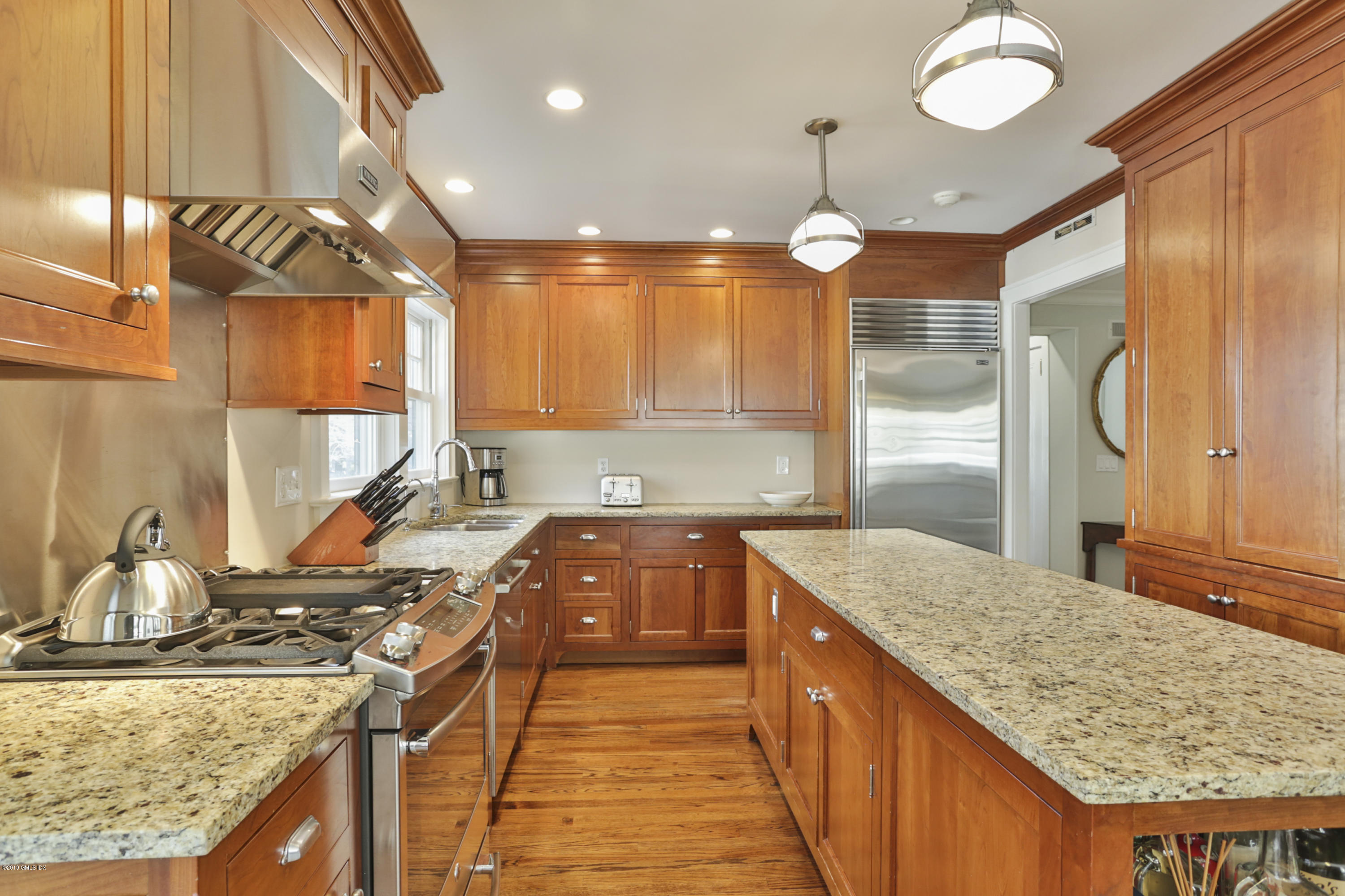 36 Valleywood Road Cos Cob, CT 06830 - Photo 10 of 45 a kitchen with stainless steel appliances granite countertop a sink a stove and a wooden floors