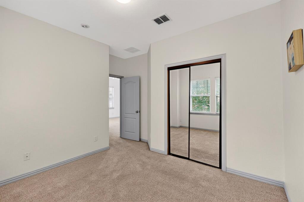 4015 Rome Court Irving, TX 75038 - Photo 17 of 24 an empty room with windows