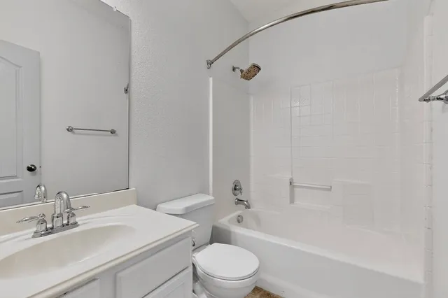 a bathroom with a sink a toilet and a bathtub