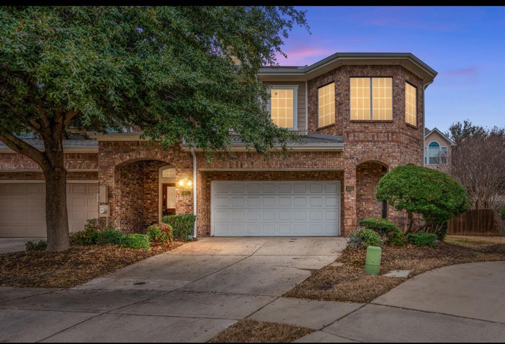 4015 Rome Court Irving, TX 75038 - Photo 2 of 24 a front view of a house with a yard and garage