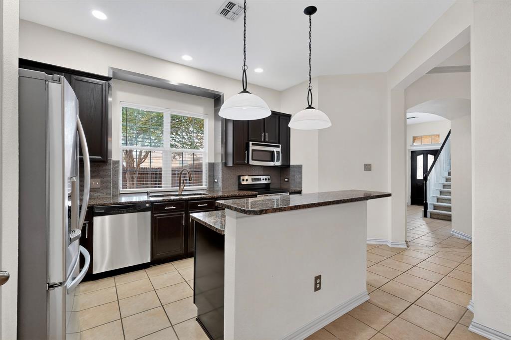 4015 Rome Court Irving, TX 75038 - Photo 3 of 24 a kitchen with stainless steel appliances granite countertop a refrigerator a sink a stove and a refrigerator