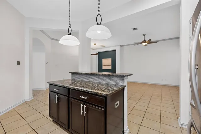 a kitchen with a counter space cabinets and appliances