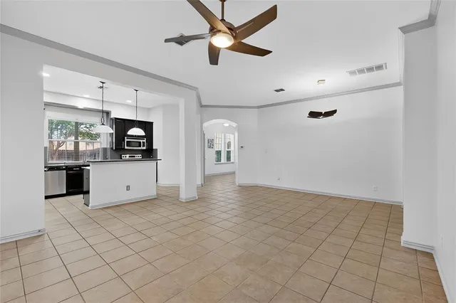 a view of a kitchen with a sink and cabinets
