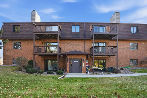 a view of a building with a yard