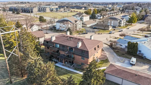 an aerial view of a house with outdoor space