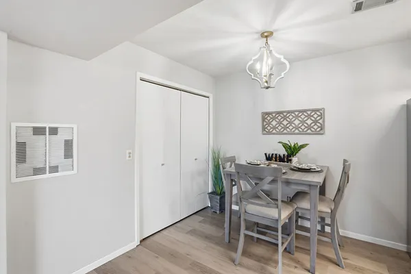 a view of a dining room with furniture and wooden floor