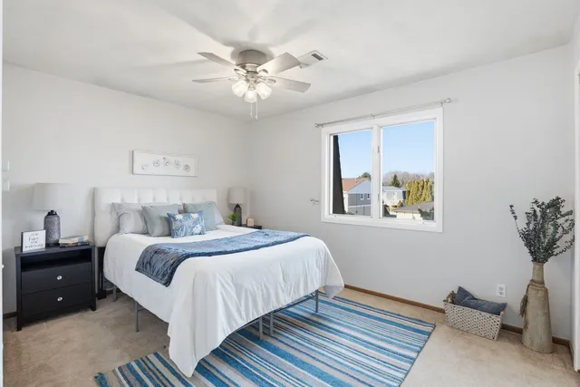 a bedroom with bed and window