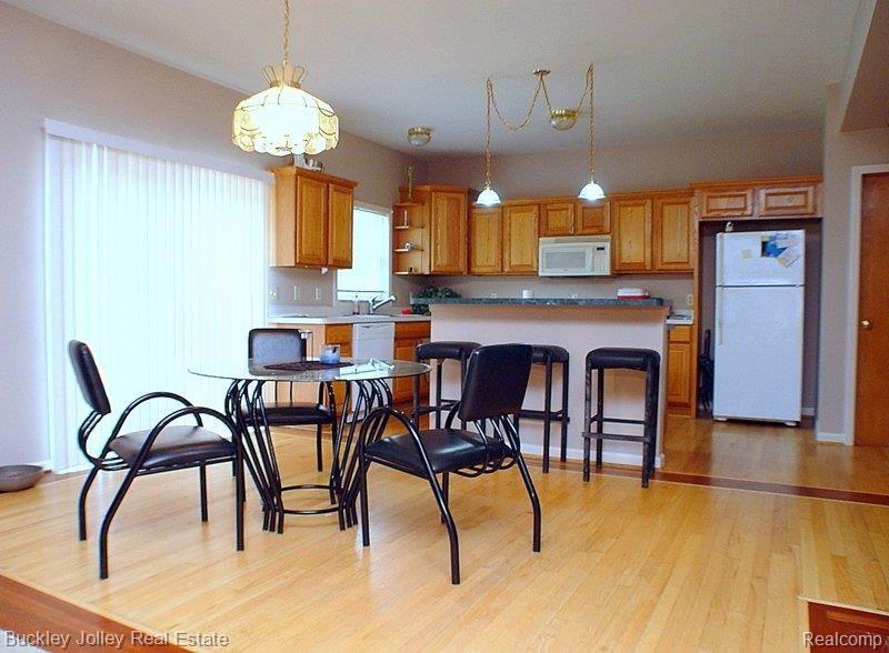 2385 Botsford Road Howell, MI 48855 - Photo 7 of 19 Light Wood Floors.jpg