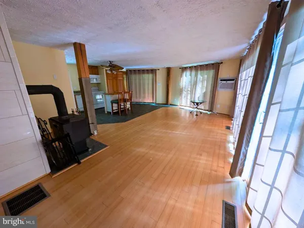 a view of a room with furniture and a window