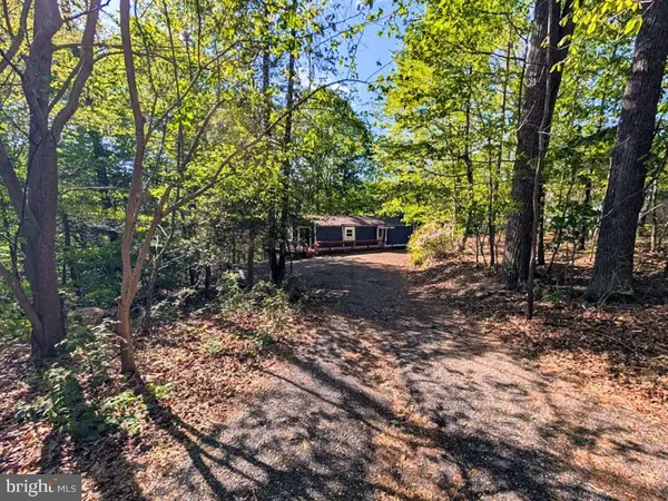 a view of outdoor space with deck and yard