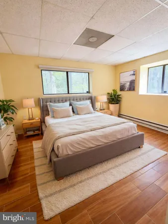 a bedroom with a large bed and a balcony