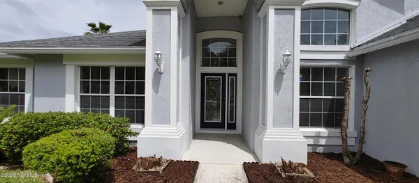 a front view of a house with a yard