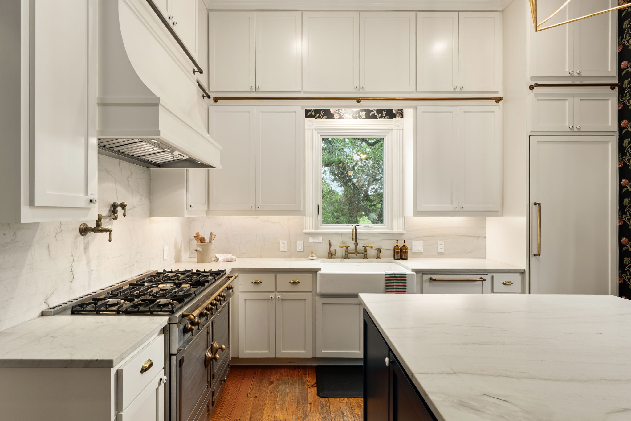 3409 Gatlin Creek Road Dripping Springs, TX 78620 - Photo 11 of 40 a kitchen with white cabinets and white appliances