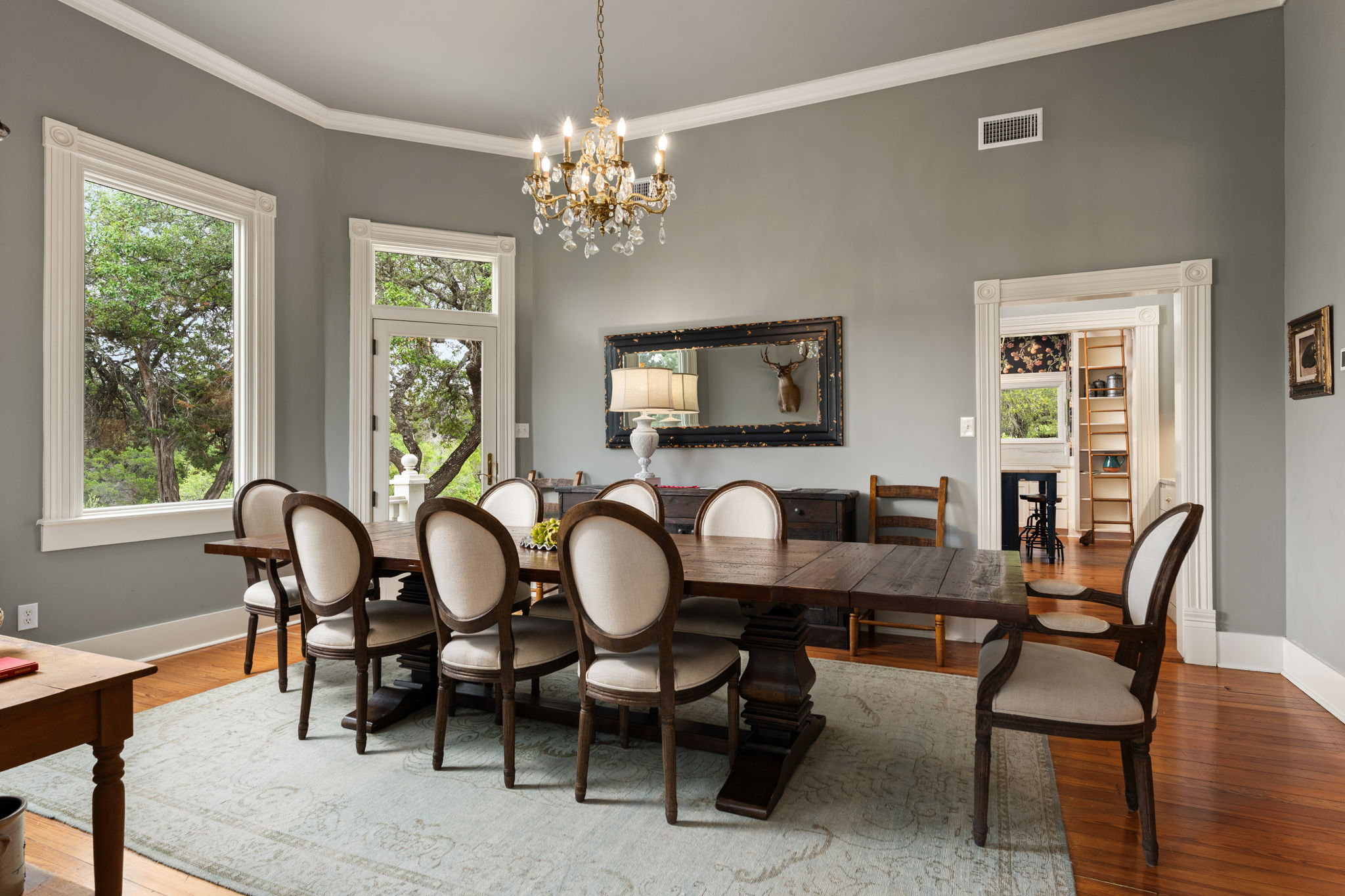 3409 Gatlin Creek Road Dripping Springs, TX 78620 - Photo 12 of 40 a view of a dining room with furniture window and wooden floor
