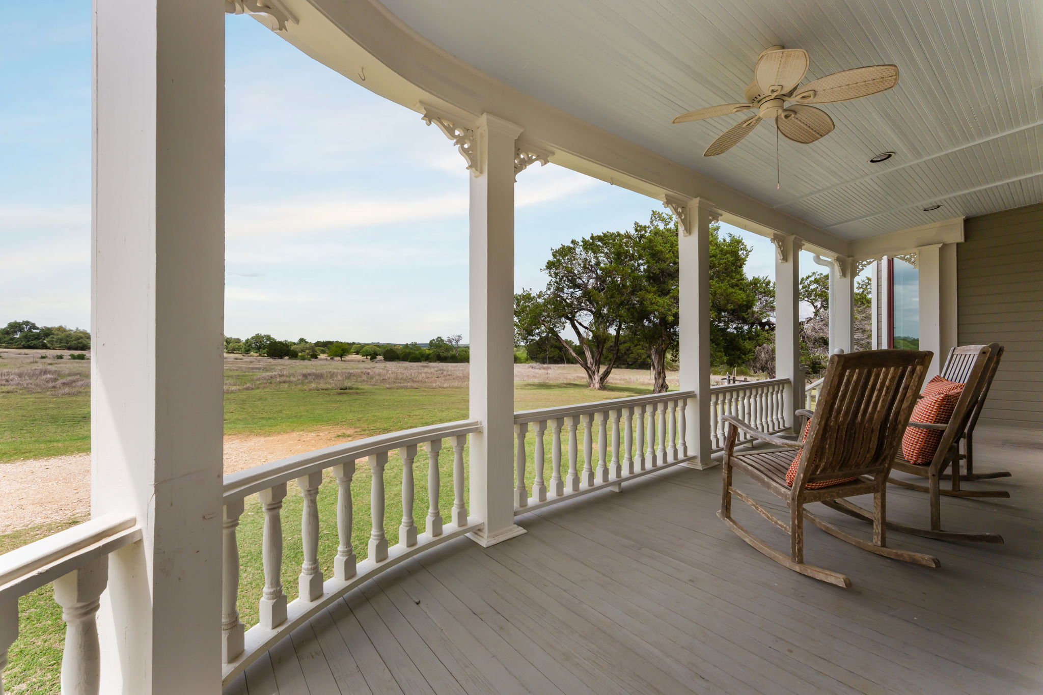 3409 Gatlin Creek Road Dripping Springs, TX 78620 - Photo 5 of 40 a view of a city from a balcony with furniture