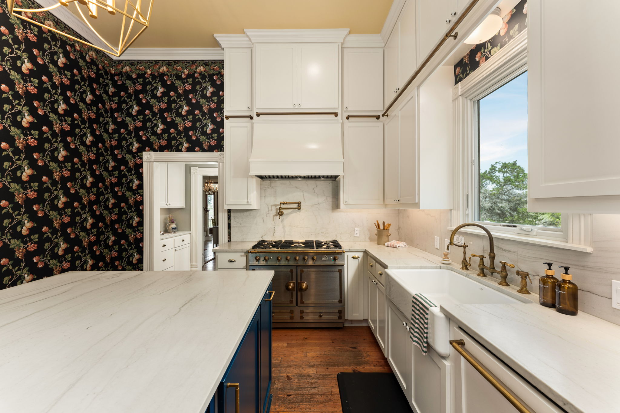 3409 Gatlin Creek Road Dripping Springs, TX 78620 - Photo 10 of 40 a kitchen with a sink a stove and cabinets