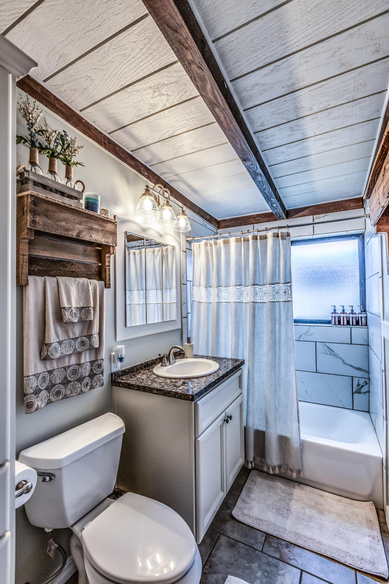 3372 Edgewood Road Myrtletown, CA 95501 - Photo 24 of 44 a bathroom with a granite countertop toilet sink and mirror