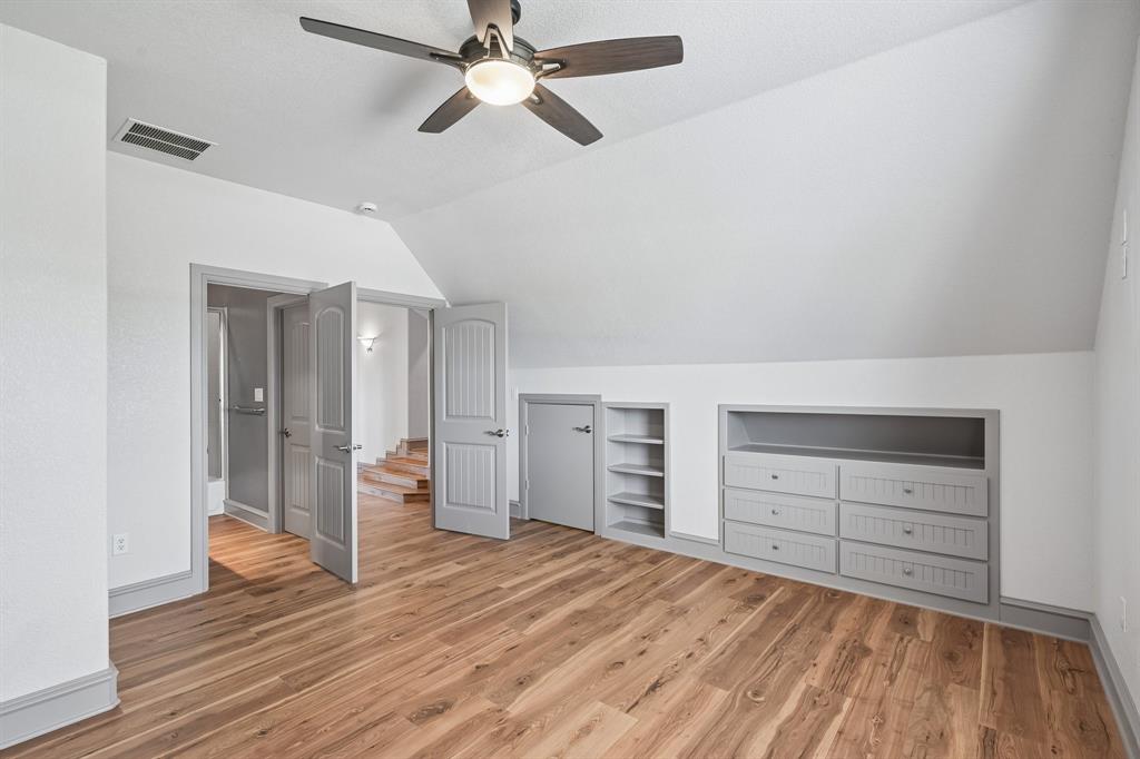 2085 Switzer Road Sanger, TX 76266 - Photo 30 of 39 Room featuring wood-finish flooring, a ceiling fan with integrated lighting, and white walls