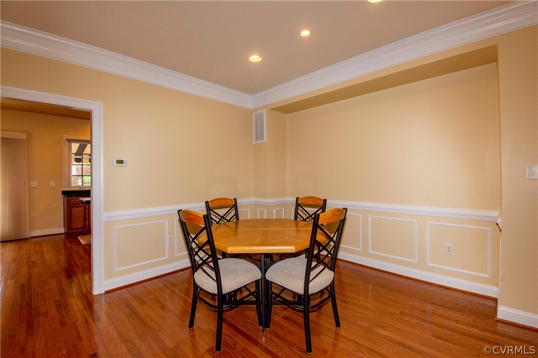 1122 Hyde Lane Henrico, VA 23229 - Photo 11 of 50 a dining room with furniture and wooden floor