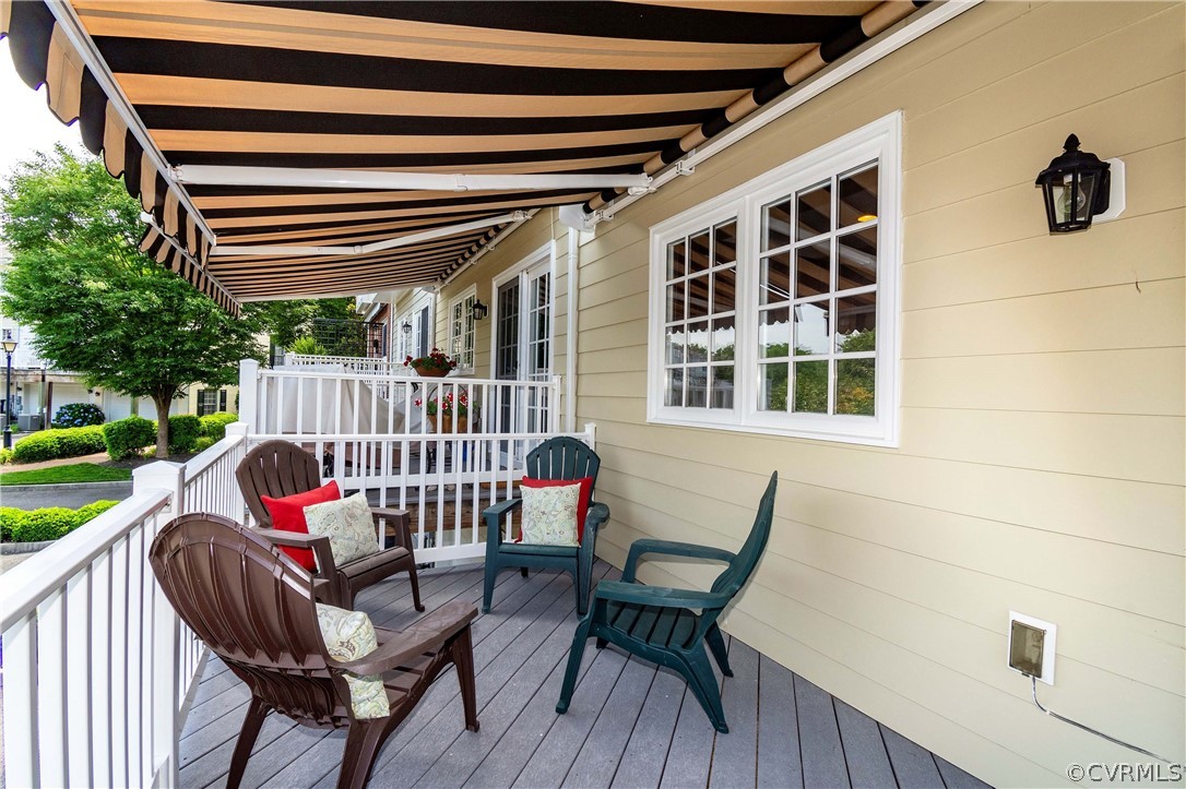 1122 Hyde Lane Henrico, VA 23229 - Photo 19 of 50 a view of balcony with wooden floor outdoor seating and yard in back