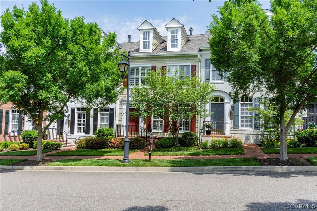 1122 Hyde Lane Henrico, VA 23229 - Photo 2 of 50 a front view of a house with a yard and potted plants