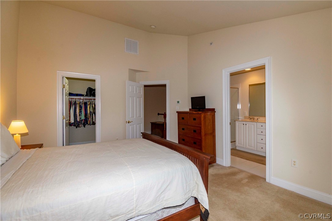 1122 Hyde Lane Henrico, VA 23229 - Photo 22 of 50 a bedroom with a bed and a dresser