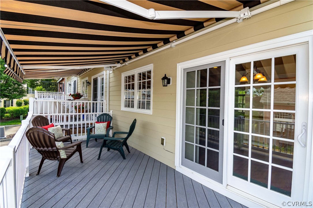 1122 Hyde Lane Henrico, VA 23229 - Photo 40 of 50 a view of a deck with table and chairs and wooden floor