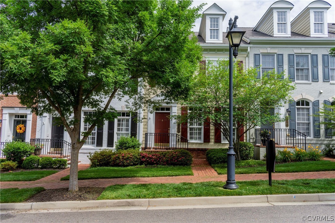 1122 Hyde Lane Henrico, VA 23229 - Photo 47 of 50 a front view of a house with a garden and plants