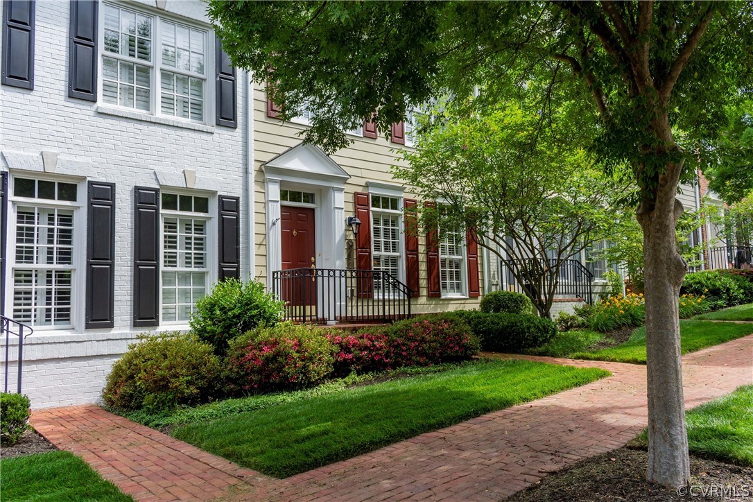 1122 Hyde Lane Henrico, VA 23229 - Photo 49 of 50 a view of a house with brick walls plants and large tree