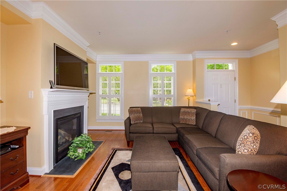1122 Hyde Lane Henrico, VA 23229 - Photo 7 of 50 a living room with furniture and a fireplace