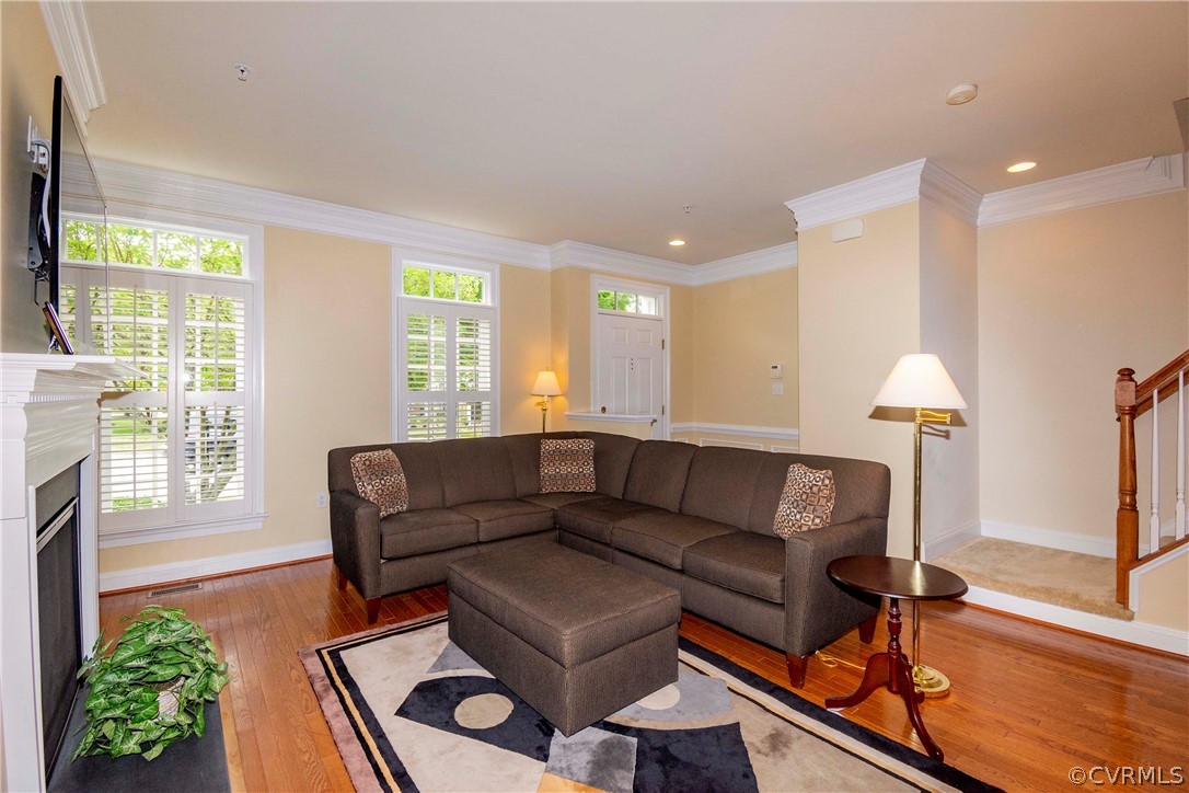 1122 Hyde Lane Henrico, VA 23229 - Photo 8 of 50 a living room with furniture and a fireplace