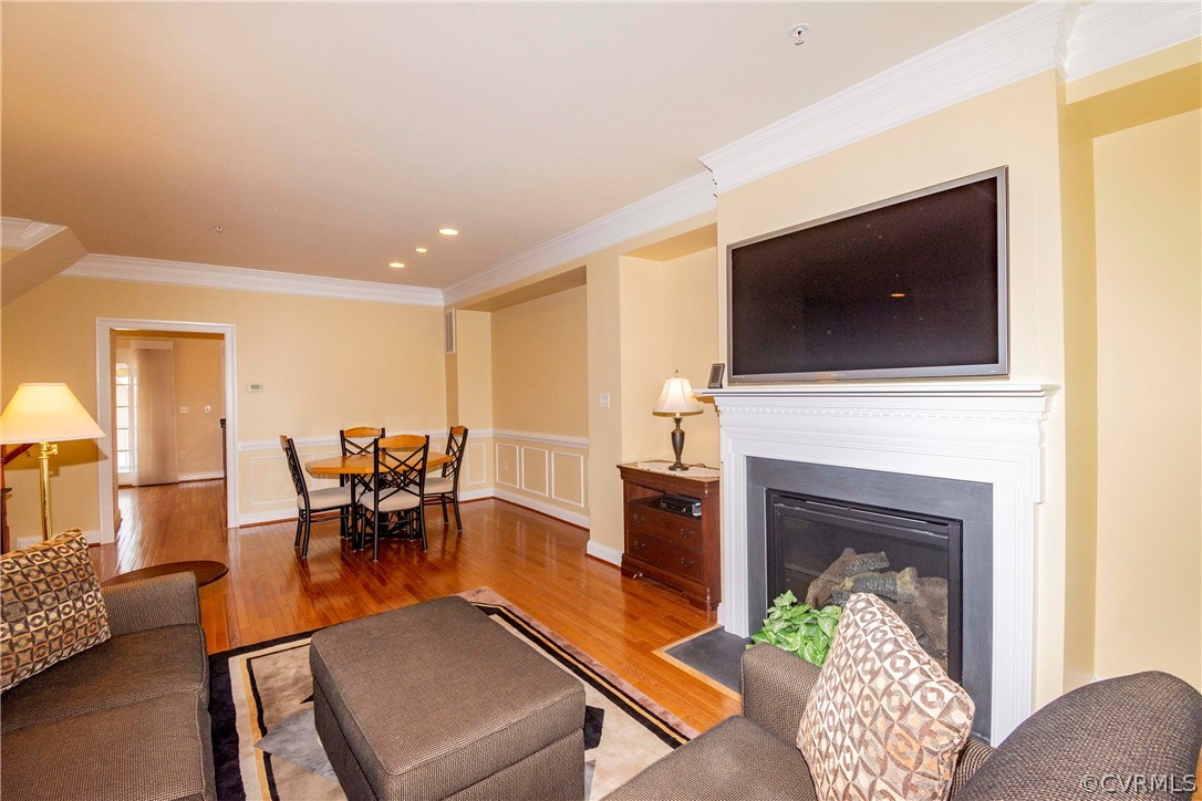 1122 Hyde Lane Henrico, VA 23229 - Photo 10 of 50 a living room with furniture a flat screen tv and a fireplace
