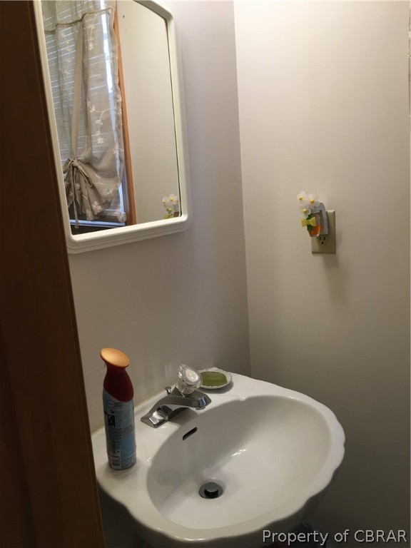 2573 Wright Road Saluda, VA 23149 - Photo 19 of 30 Pedestal sink in toilet room in master bath
