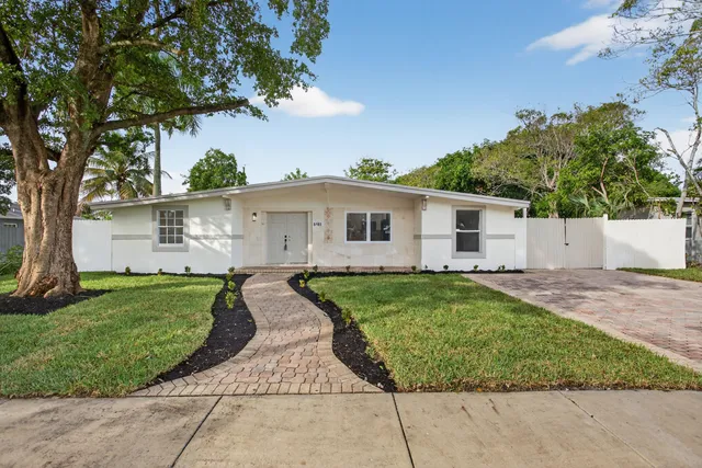 front view of a house with a yard
