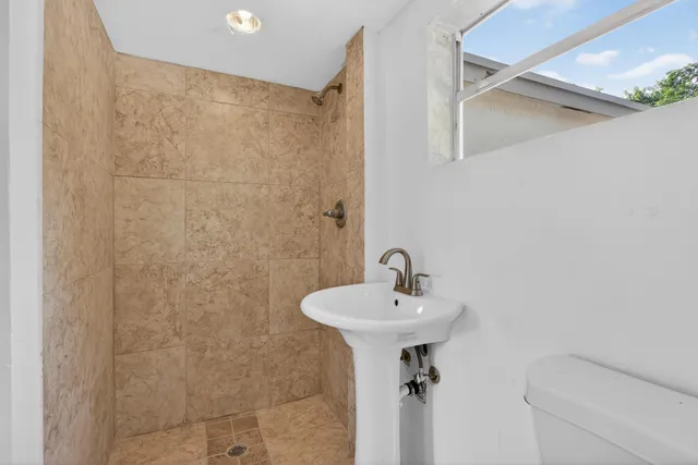 a view of a room with wooden floor and window