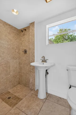 a kitchen with stainless steel appliances a refrigerator and a stove top oven