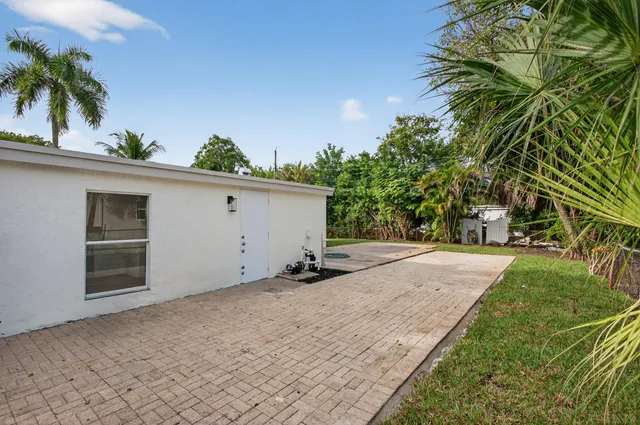 a view of a garage with a tree
