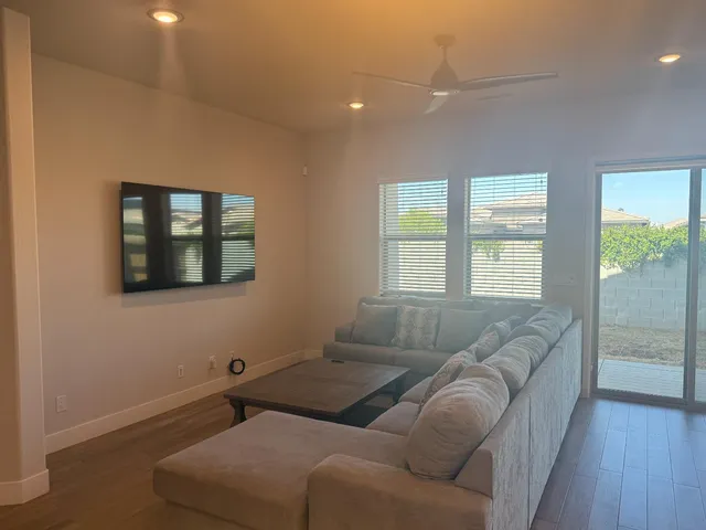 a living room with furniture and a window