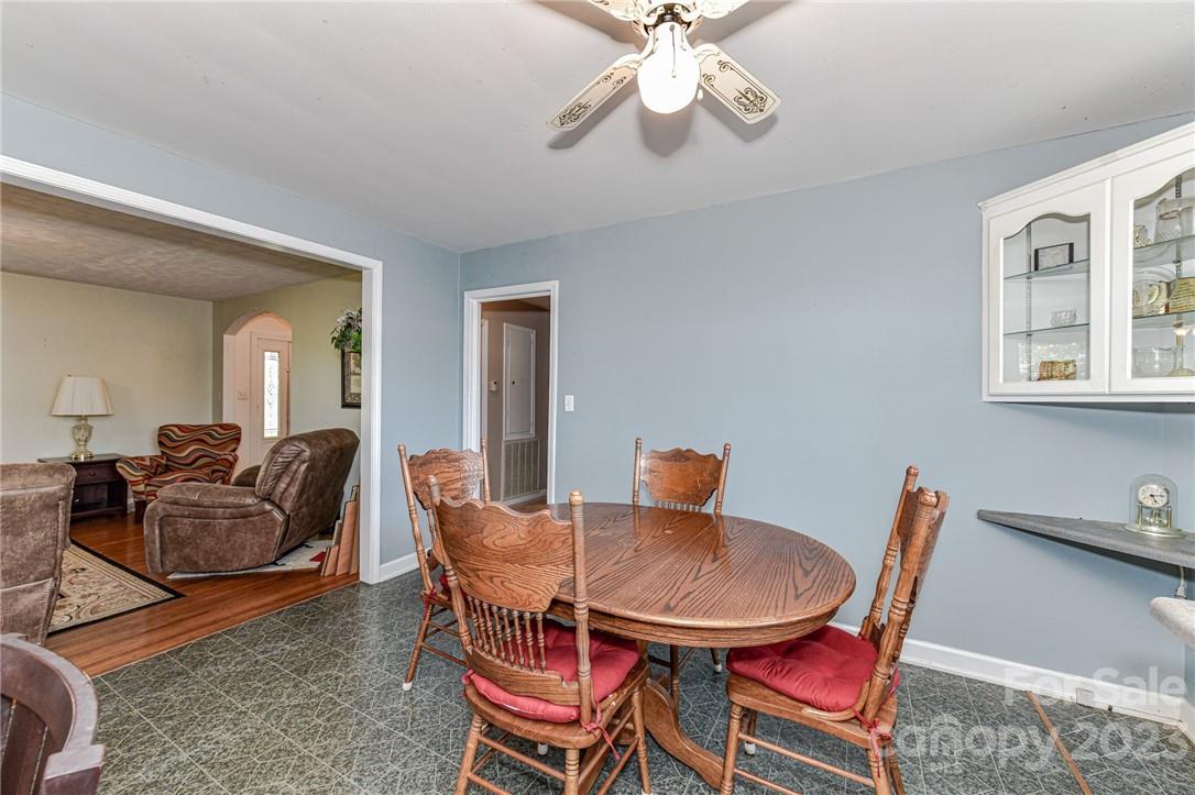 6308 Indian Trail Fairview Road Hemby Bridge, NC 28079 - Photo 16 of 36 a dining room with furniture a rug and wooden floor