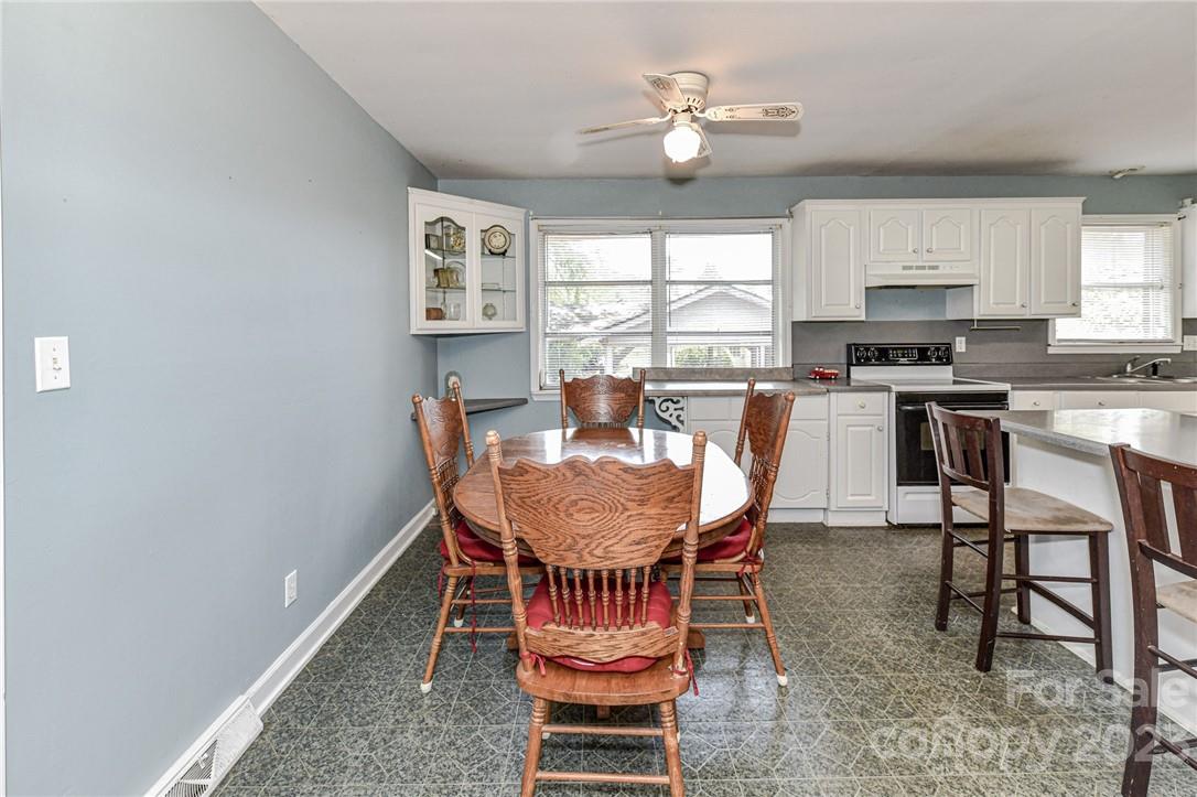6308 Indian Trail Fairview Road Hemby Bridge, NC 28079 - Photo 17 of 36 a view of a dining room with furniture window and wooden floor