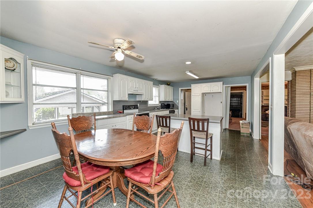 6308 Indian Trail Fairview Road Hemby Bridge, NC 28079 - Photo 18 of 36 a dining room with furniture window and wooden floor