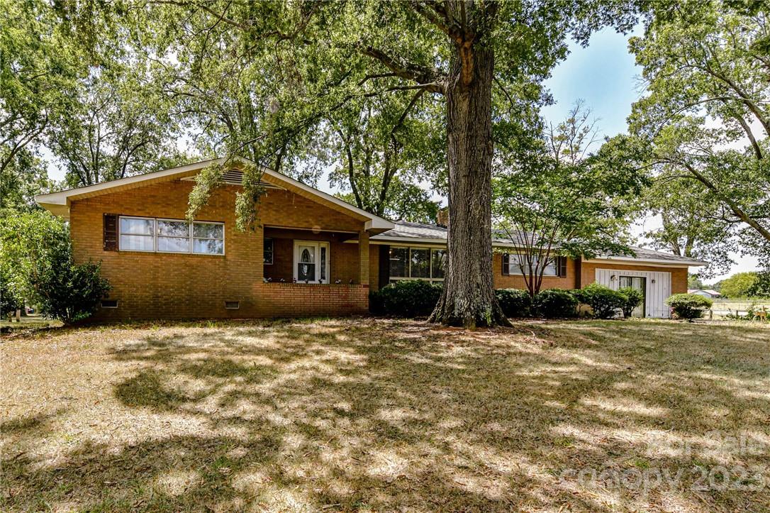 6308 Indian Trail Fairview Road Hemby Bridge, NC 28079 - Photo 2 of 36 a front view of a house with a yard